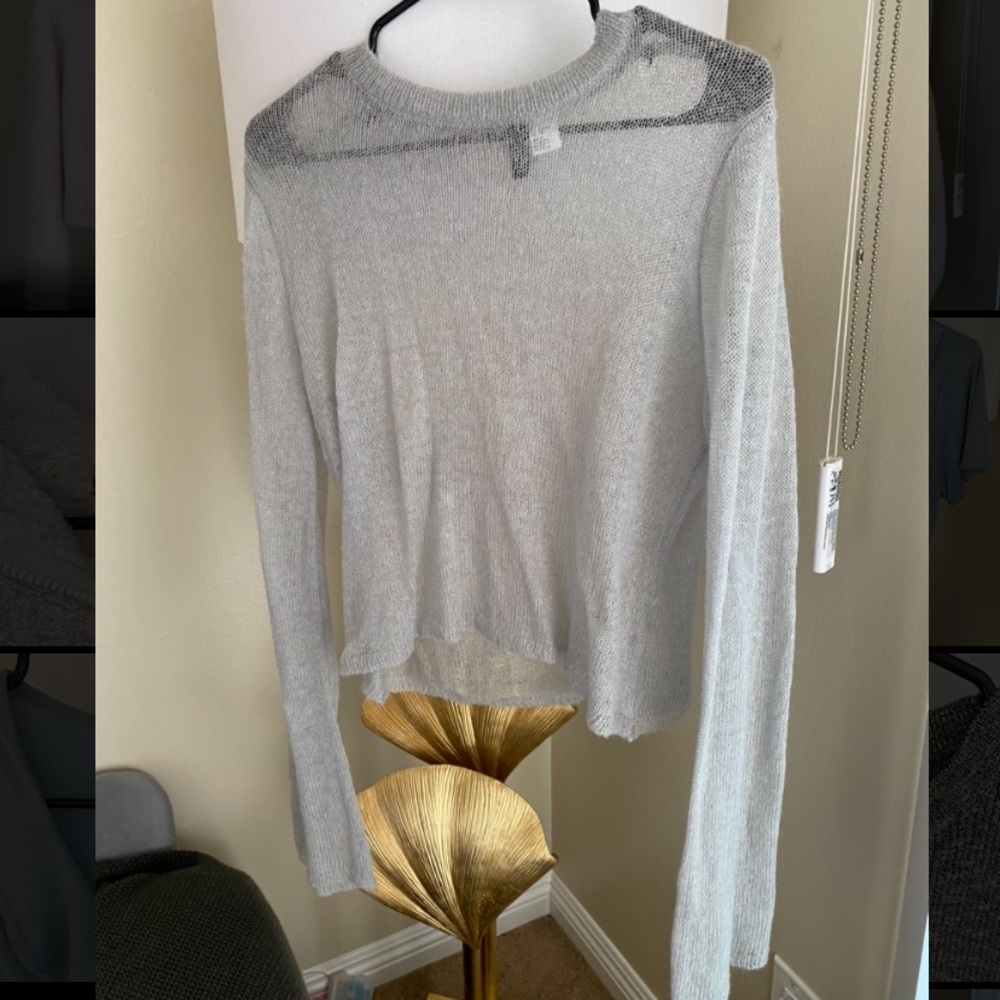 Sheer lightweight sweater-trumpet sleeves.